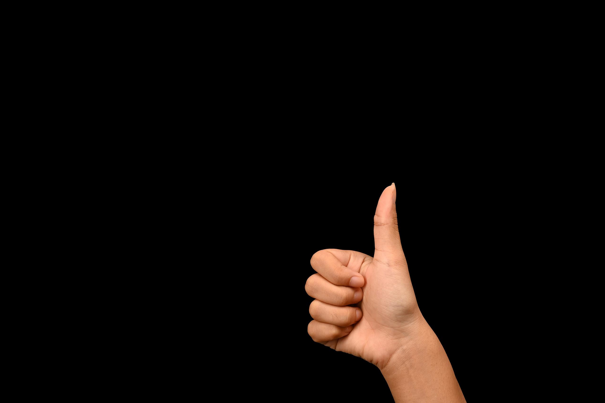 woman hand showing thumbs up ok and peace signs a 2024 12 02 22 39 42 utc